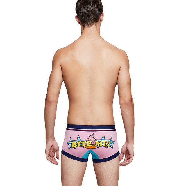 Rear view of pink Bite Me boxers with navy trim and colorful cartoon bite graphic