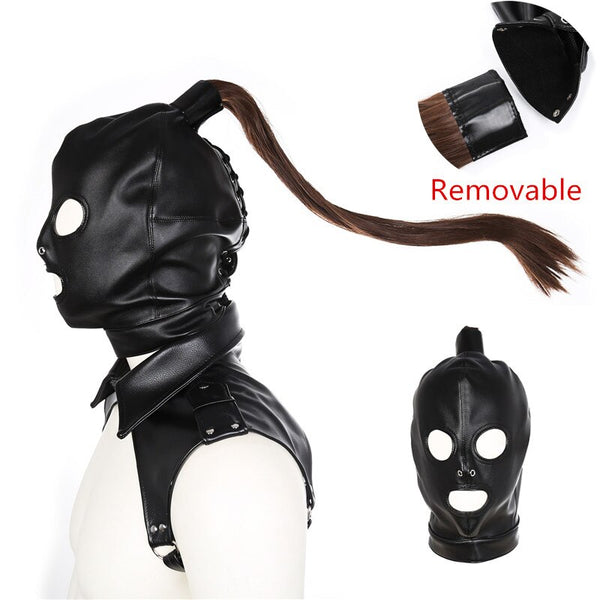Black leather bondage hood with eye and mouth openings, shown with a removable brown ponytail