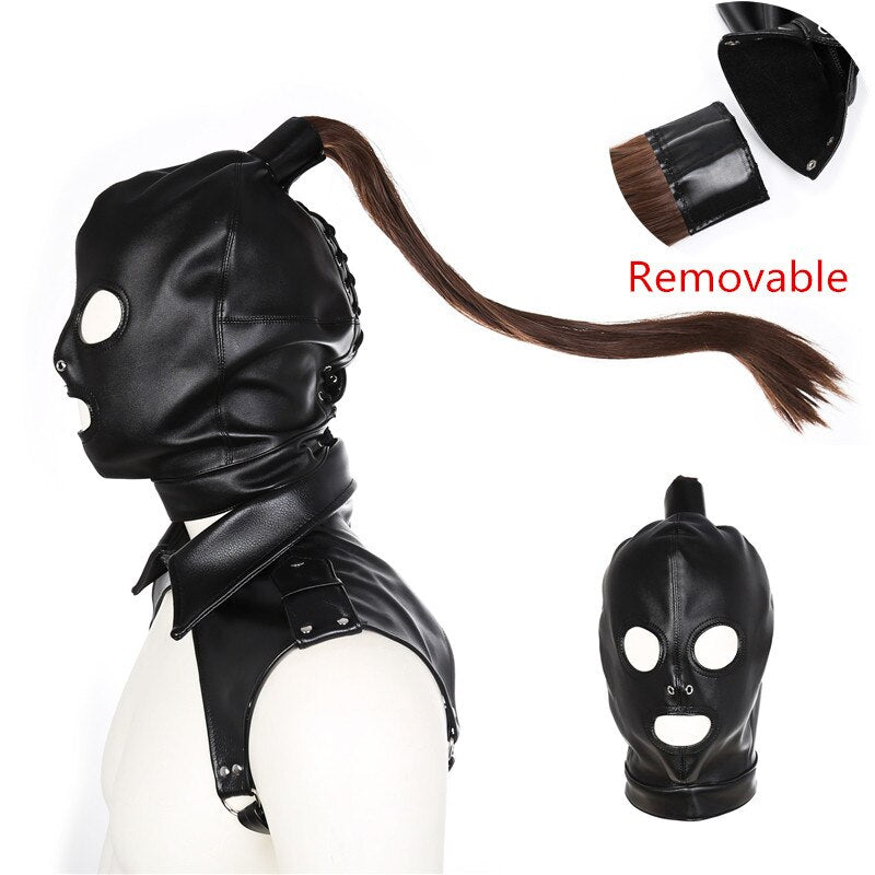 Black leather bondage hood with eye and mouth openings, shown with a removable brown ponytail