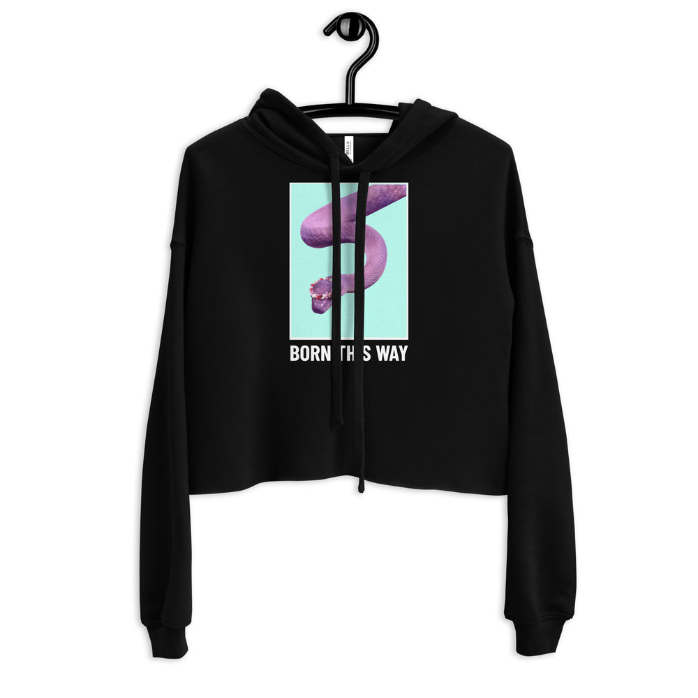 Front view of a black cropped hoodie on a hanger with a purple snake graphic and “BORN THIS WAY” text