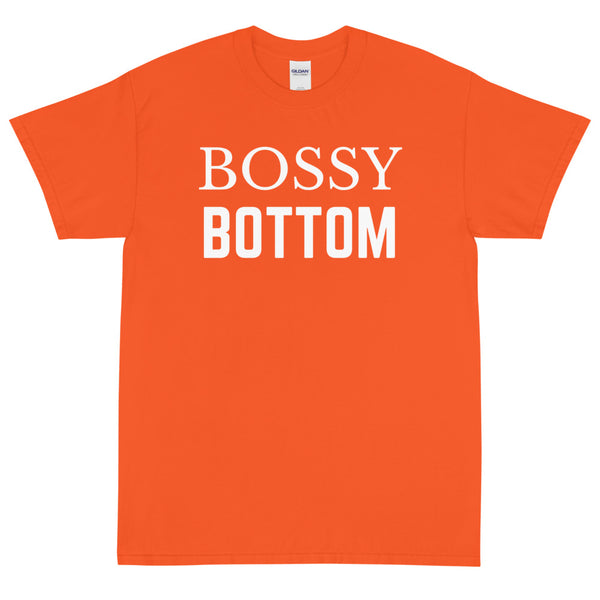 Orange T-shirt with bold white “BOSSY BOTTOM” text across the chest