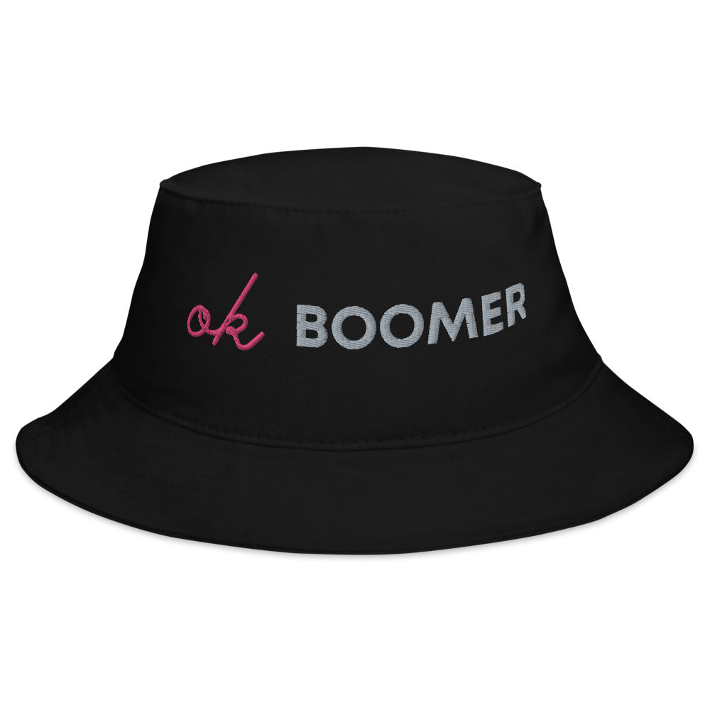 Black bucket hat embroidered with pink script and the word “BOOMER” in gray