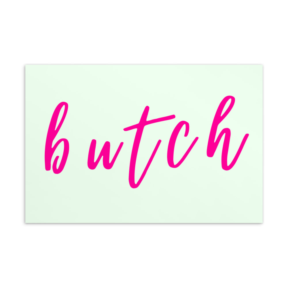 Front view of a pale green postcard with large pink cursive lettering reading “butch”