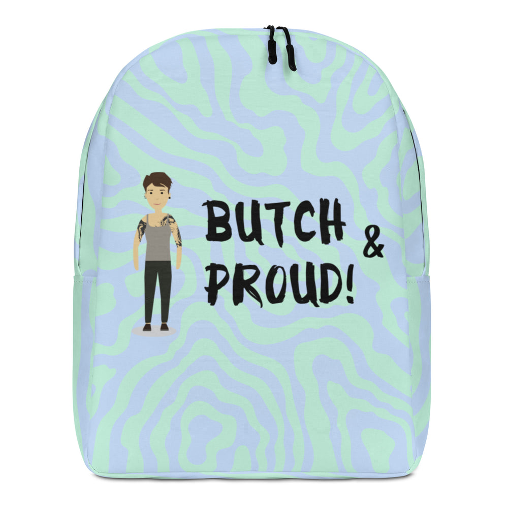 Front view of a pastel green and lavender backpack reading “BUTCH & PROUD!” with a tattooed figure