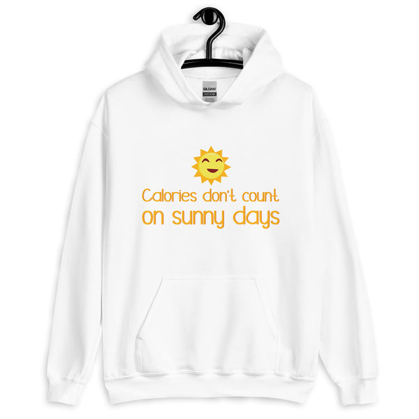 Front view of a white hoodie with a smiling sun and “Calories don’t count on sunny days”