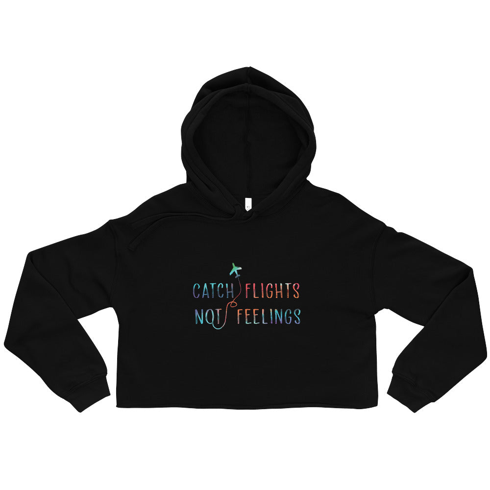 Black cropped hoodie with a colorful airplane graphic and “CATCH FLIGHTS NOT FEELINGS” text
