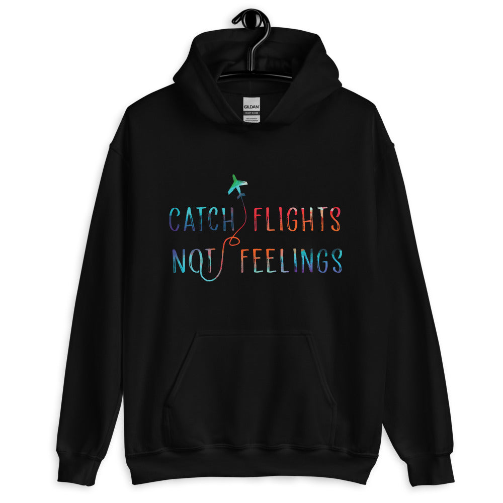 Front view of a black hoodie reading “Catch Flights Not Feelings,” with a colorful airplane graphic