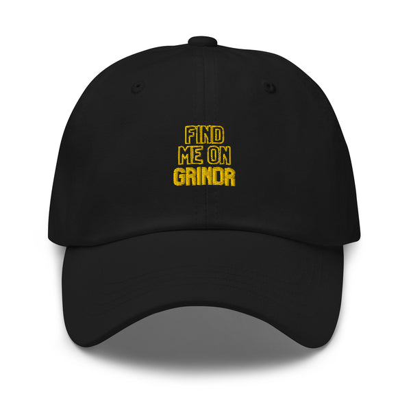 Front view of a black cap with yellow embroidered text reading “FIND ME ON GRINDR.”