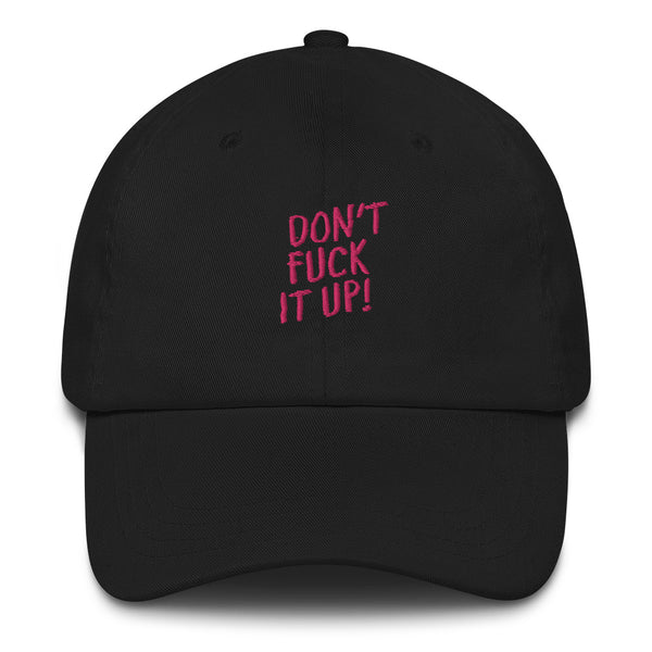 Front view of a black baseball cap with pink “DON’T FUCK IT UP!” lettering