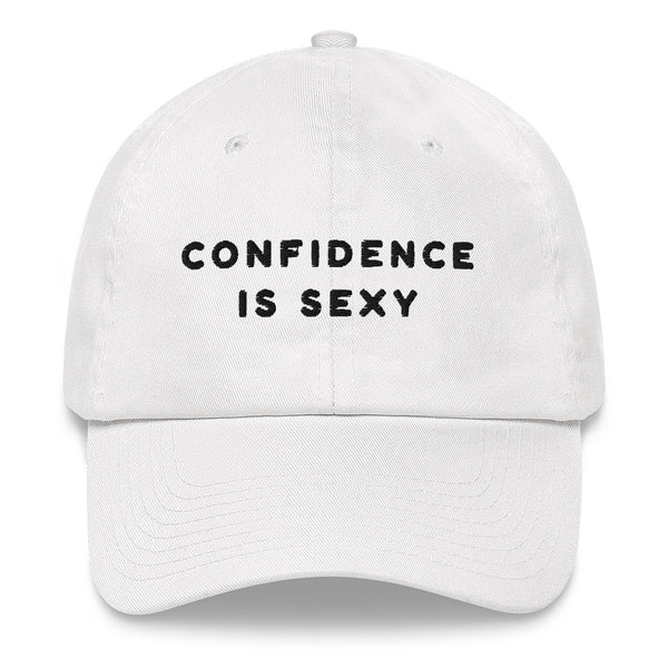 Front-facing white baseball cap embroidered with “CONFIDENCE IS SEXY” in black