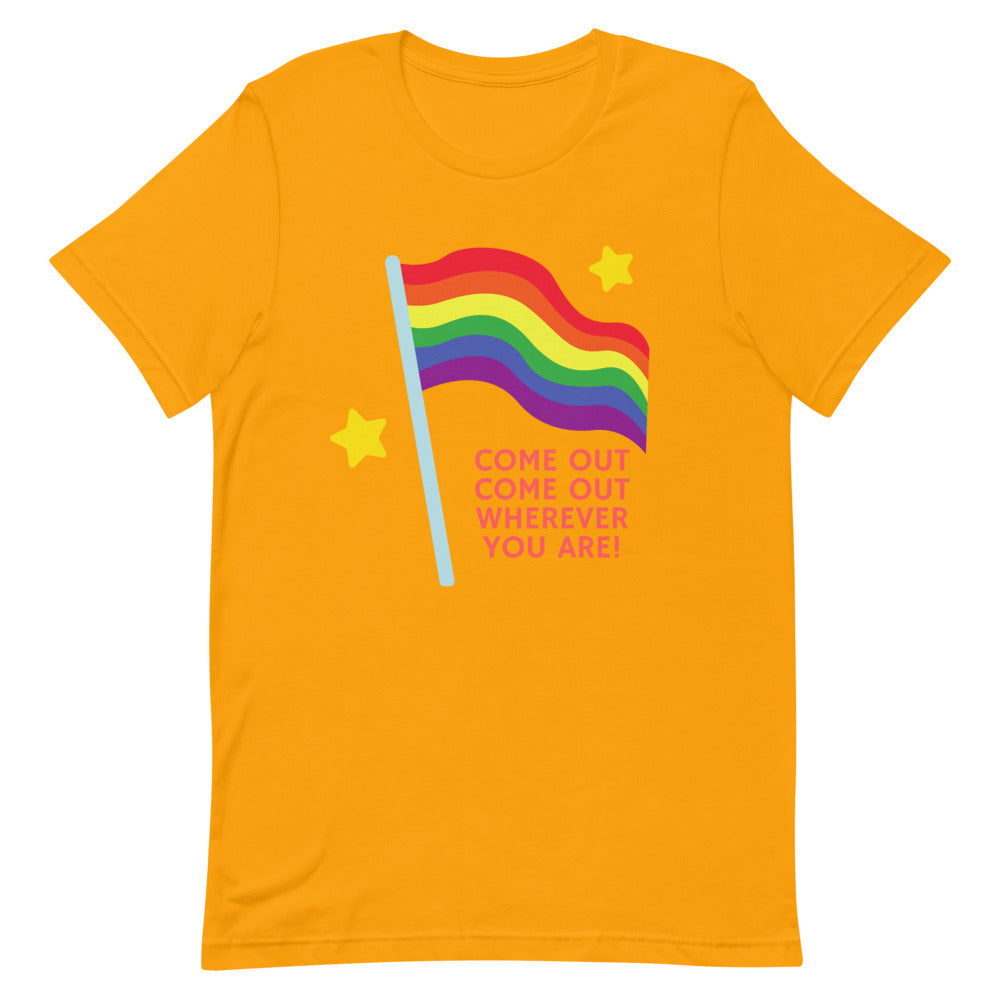 Front view of an orange T-shirt with a rainbow flag and “COME OUT COME OUT WHEREVER YOU ARE!”