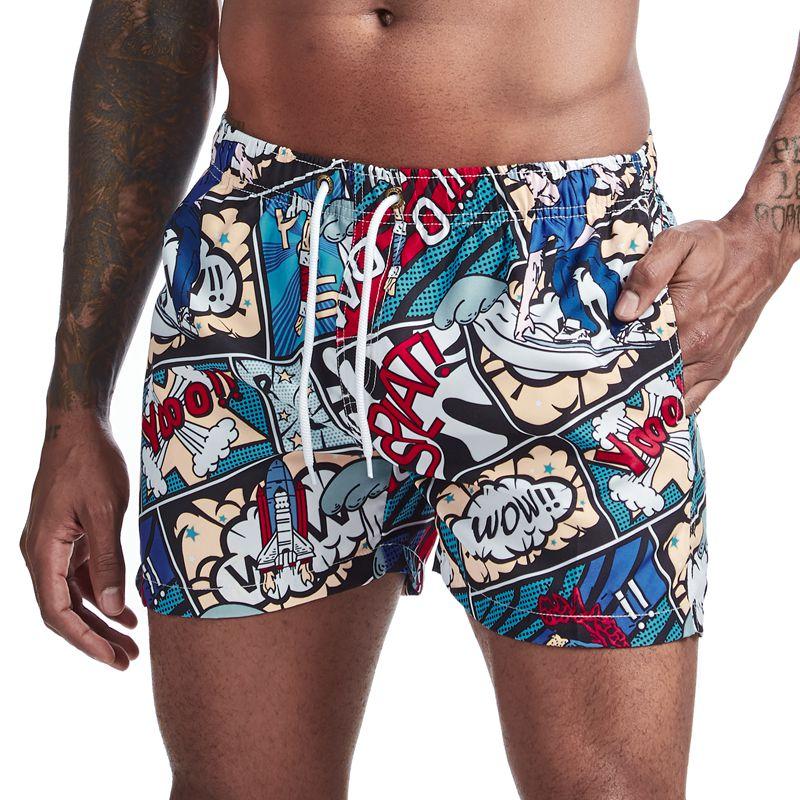 Front view of comic-book print board shorts with drawstring waist and colorful cartoon panels