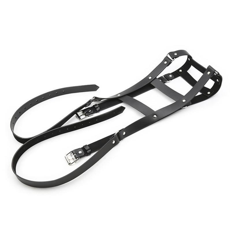 Black leather chest harness with adjustable buckle straps and silver rivets, laid flat