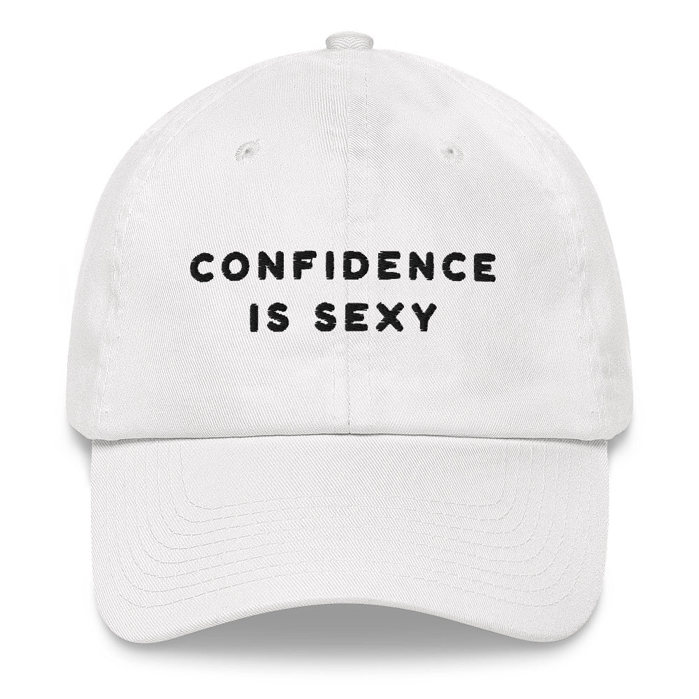 Front-facing white baseball cap embroidered with “CONFIDENCE IS SEXY” in black