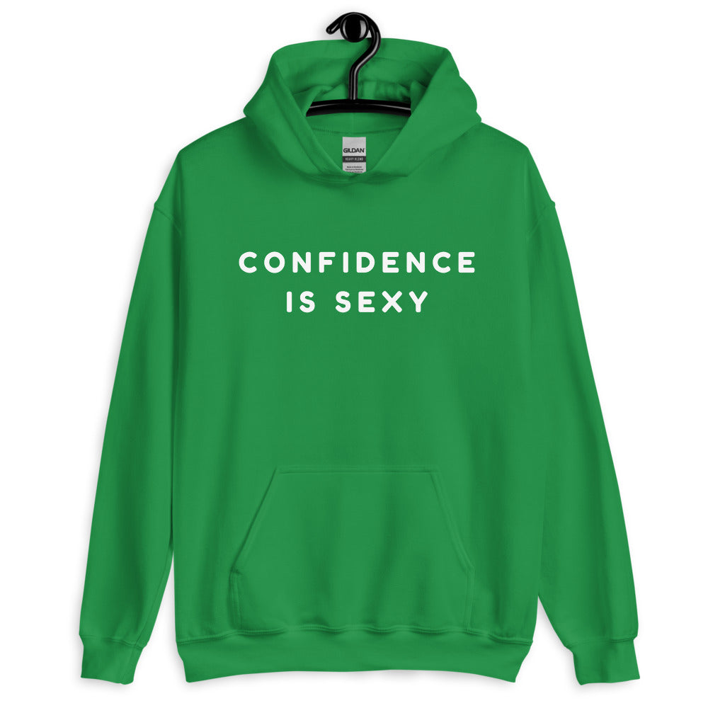Front view of a green pullover hoodie on a hanger reading “CONFIDENCE IS SEXY”