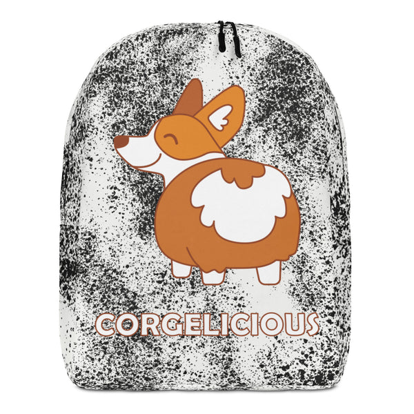 Front view of a white-and-black speckled backpack with a cartoon corgi and “CORGELICIOUS” text