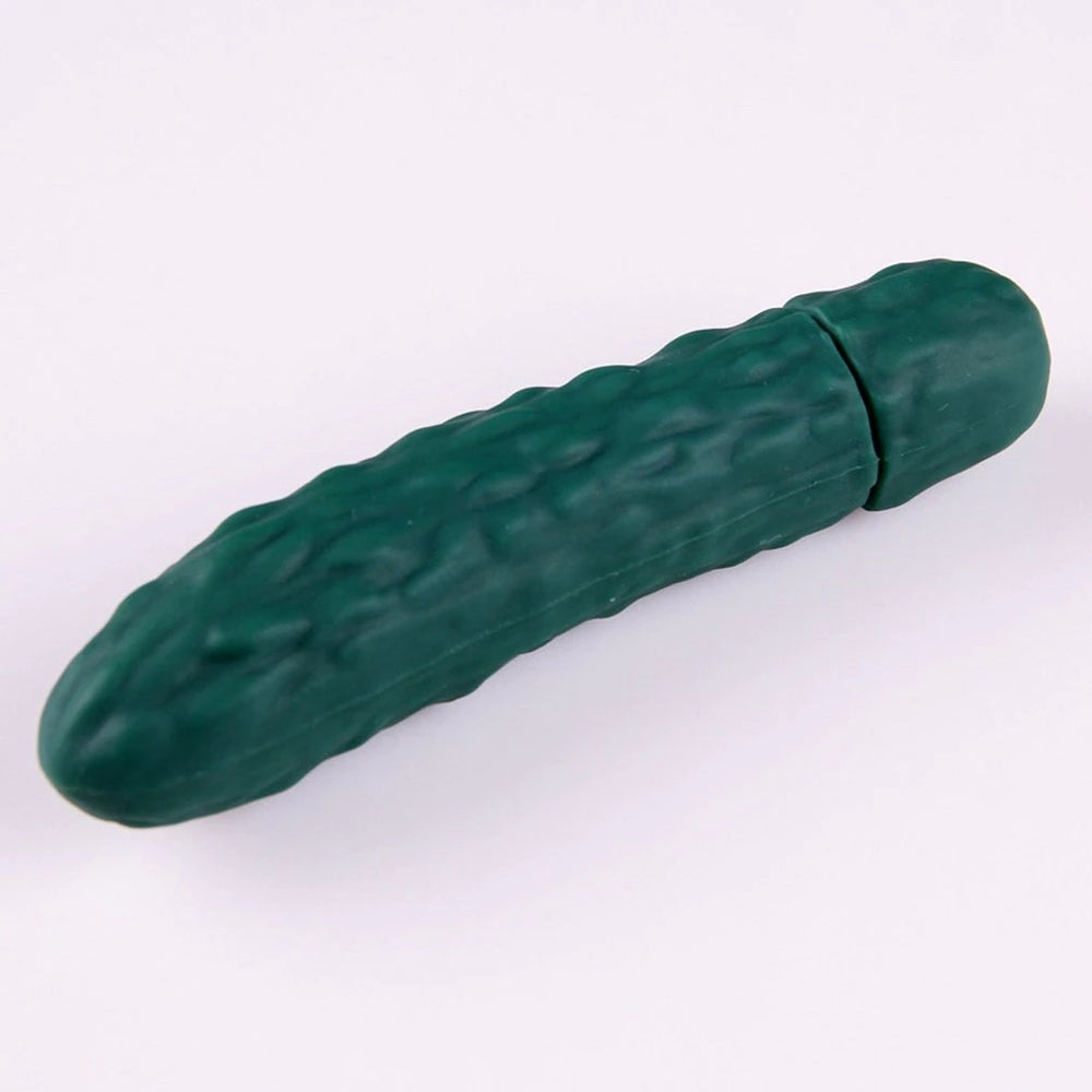 Dark green cucumber-shaped vibrator shown diagonally on a pale background