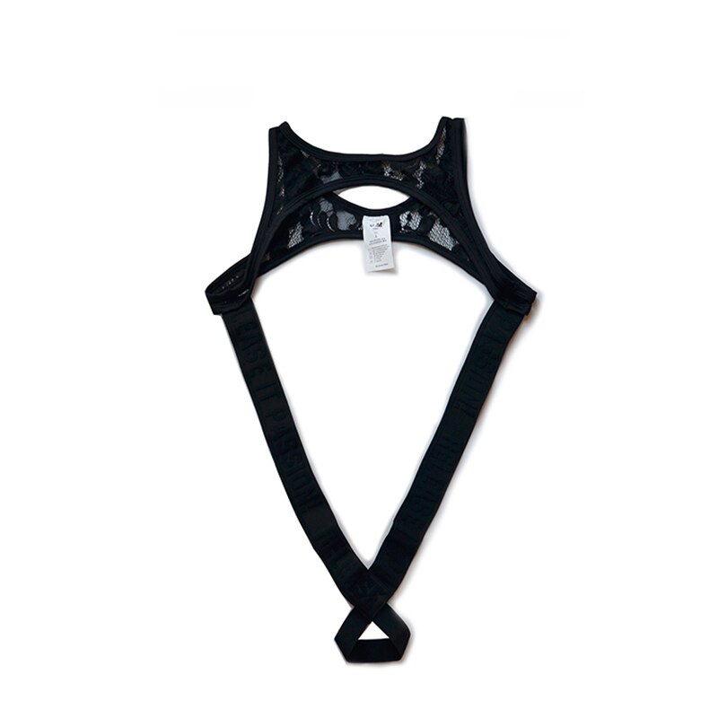 Flat-lay black lace thong bodysuit with a large front cutout and crossed straps