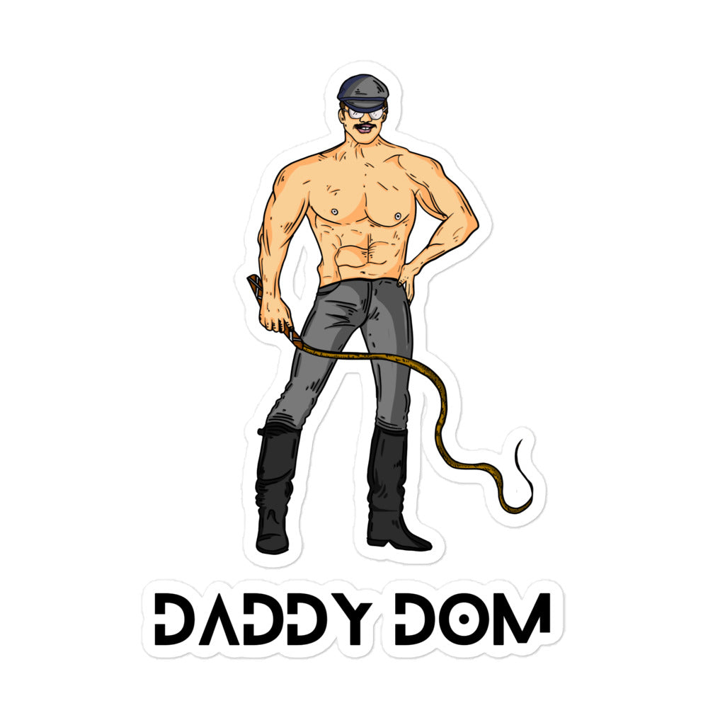 Sticker showing illustrated shirtless man in cap and leather gear holding a whip above “DADDY DOM” lettering