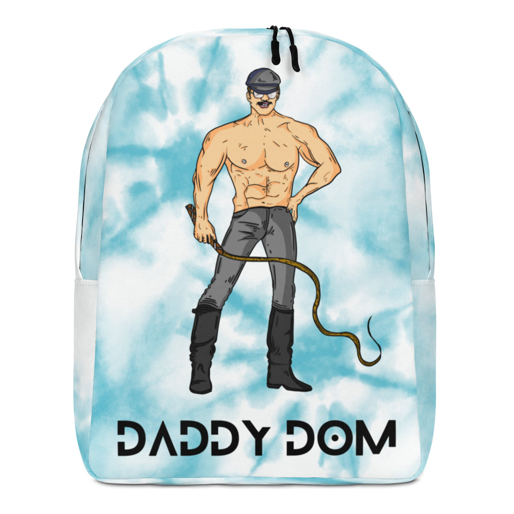 Front view of a light blue backpack with a muscular man holding a whip and “DADDY DOM” text