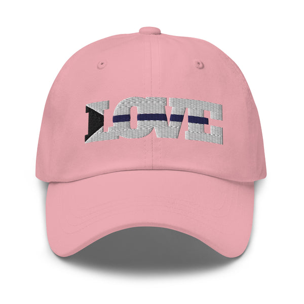 Front view of a pink cap with embroidered “LOVE” lettering and a black-and-white lightning motif