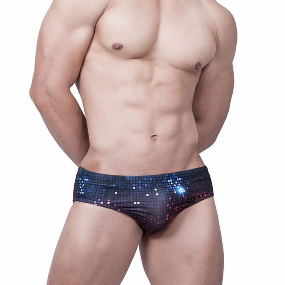 Front view of black disco-print swim briefs with blue and pink reflective square accents