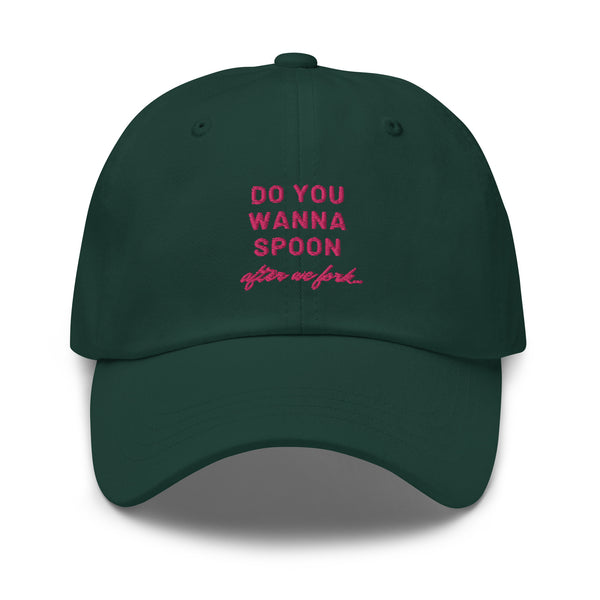 Front-facing dark green cap with pink text reading “DO YOU WANNA SPOON after we fork”