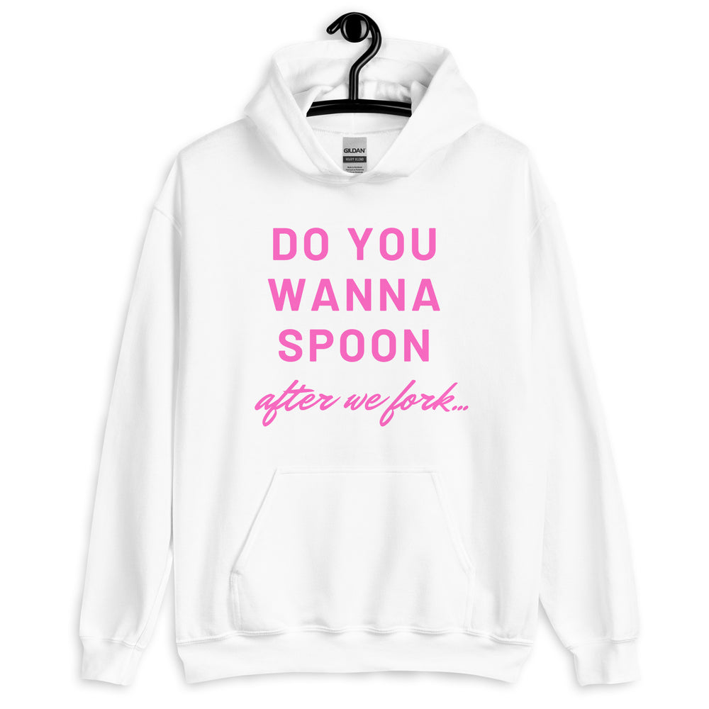 Front view of a white hoodie with pink text reading “DO YOU WANNA SPOON after we fork...”