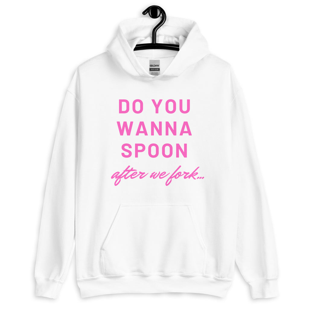 Front view of a white hoodie with pink text reading “DO YOU WANNA SPOON after we fork...”