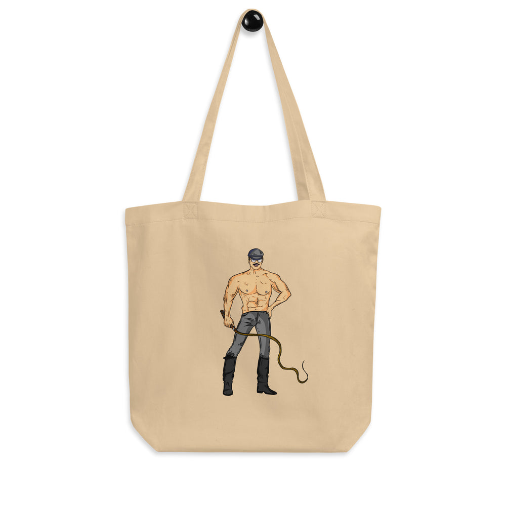 Natural canvas tote with a shirtless leather-clad man holding a whip