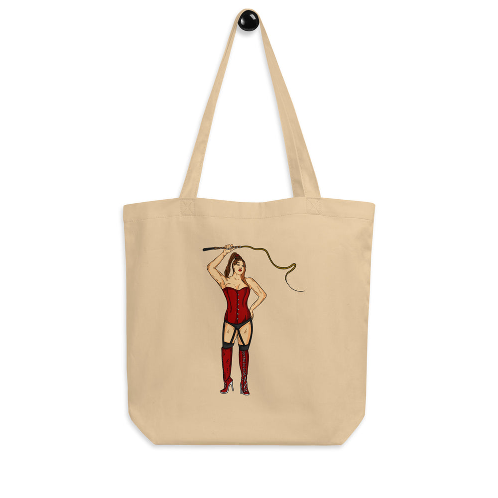 Natural canvas tote featuring an illustrated dominatrix in red corset and thigh-high boots holding a whip