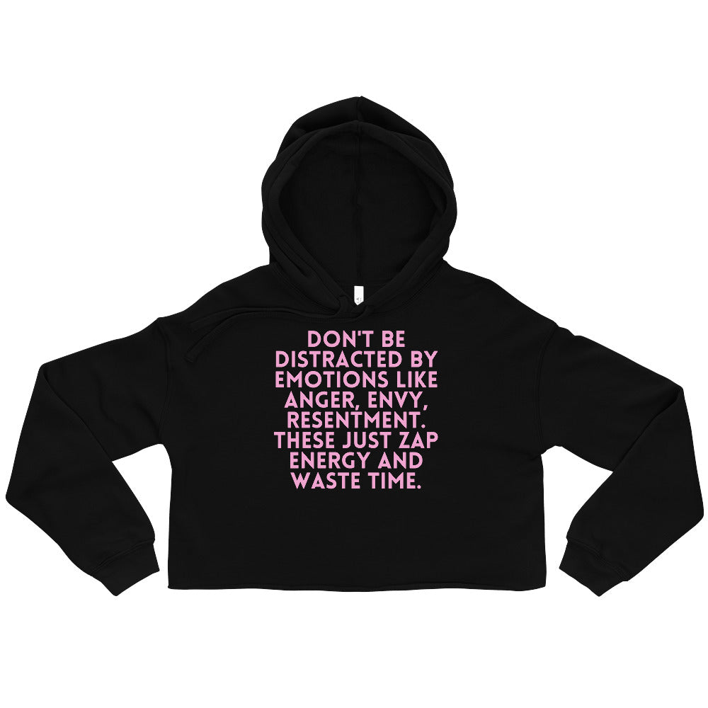 Front view of a black cropped hoodie with pink text about emotions wasting time