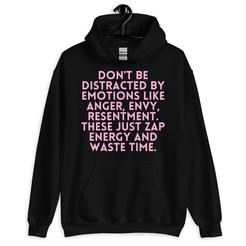 Front view of a black hoodie with large pink text reading “DON’T BE DISTRACTED BY EMOTIONS LIKE ANGER, ENVY, RESENTMENT. T...