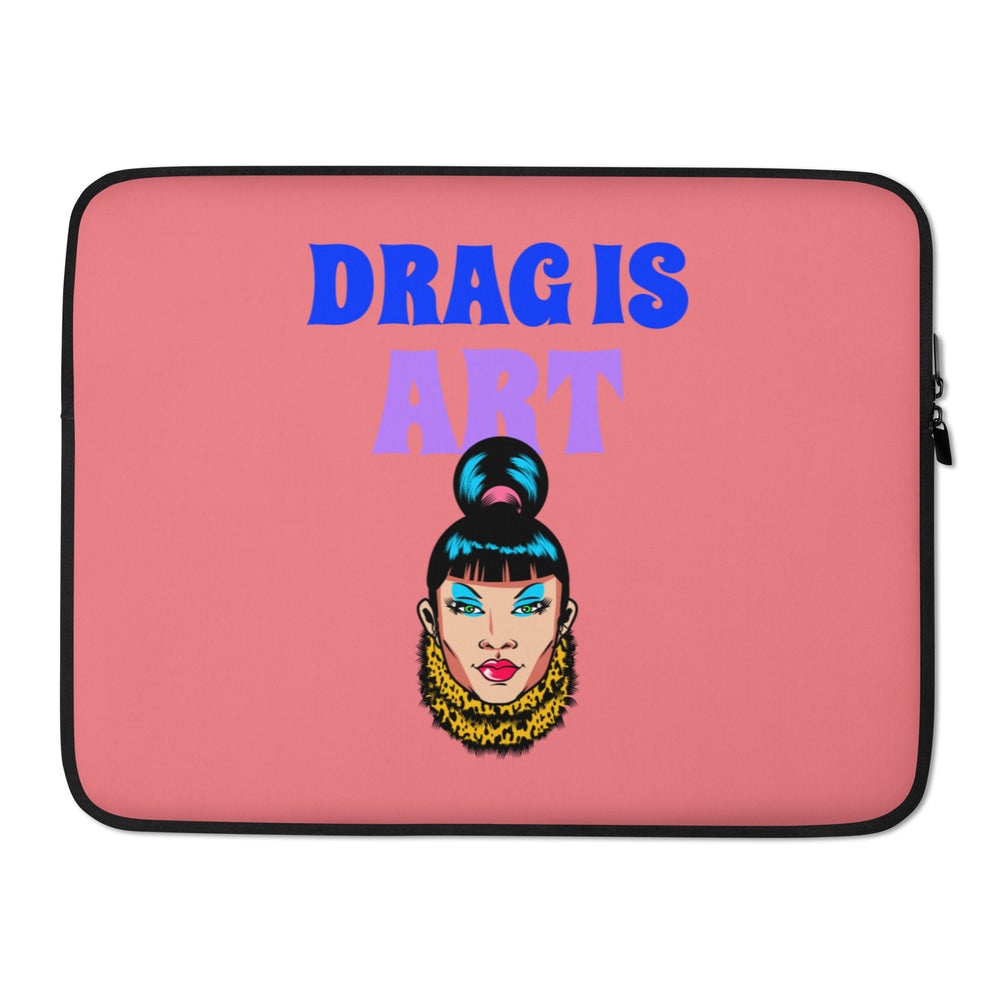 Front view of a pink laptop sleeve with black trim, “DRAGS ART” lettering, and a glam face illustration