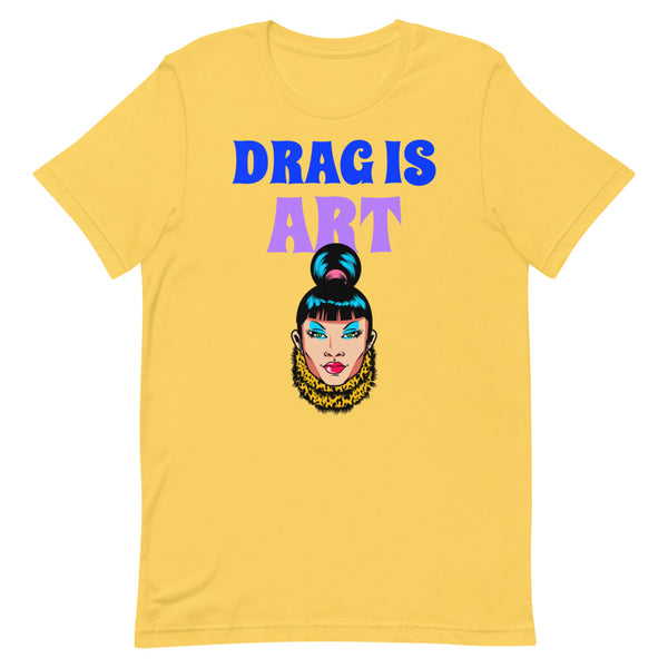 Yellow T-shirt with “DRAG IS ART” lettering and a colorful drag performer illustration