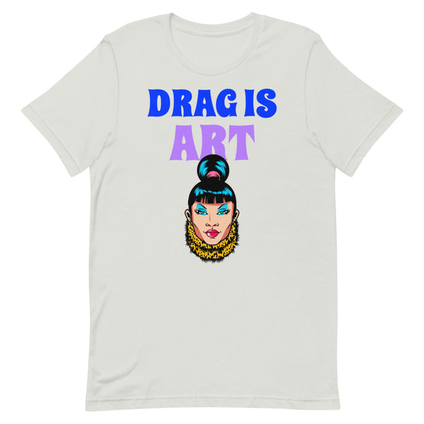 White T-shirt with “DRAG IS ART” lettering and a colorful illustrated drag queen face