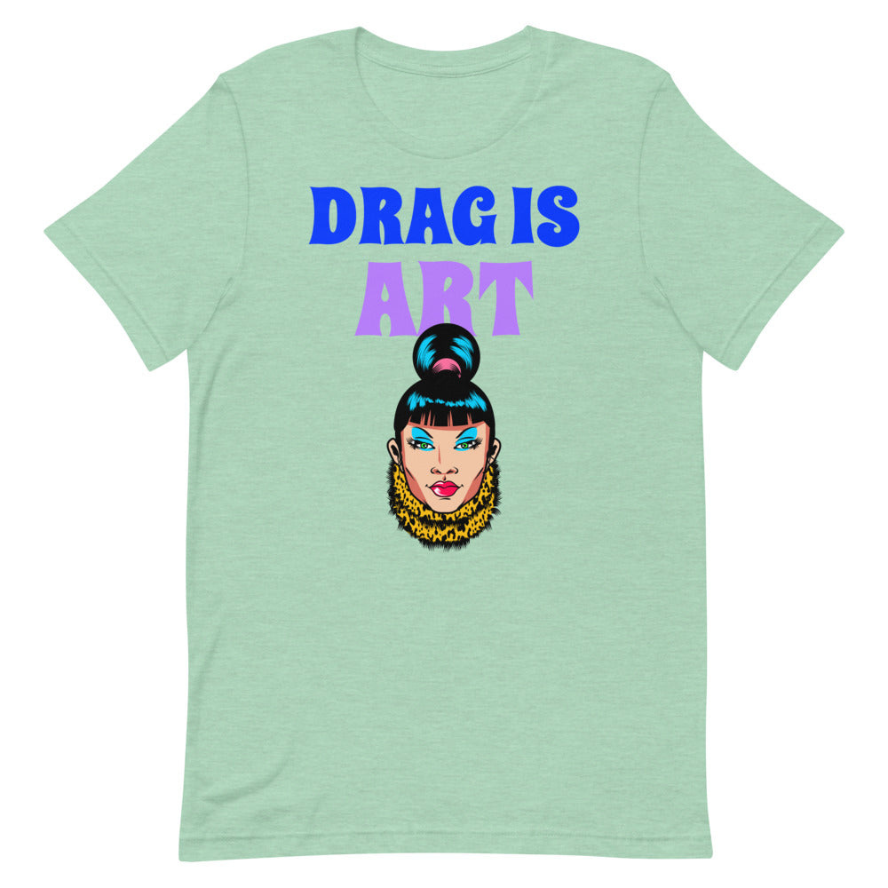Mint green T-shirt reading “DRAG IS ART” with a colorful drag performer illustration