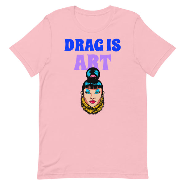 Pink T-shirt with “DRAG IS ART” lettering and a colorful drag queen portrait graphic