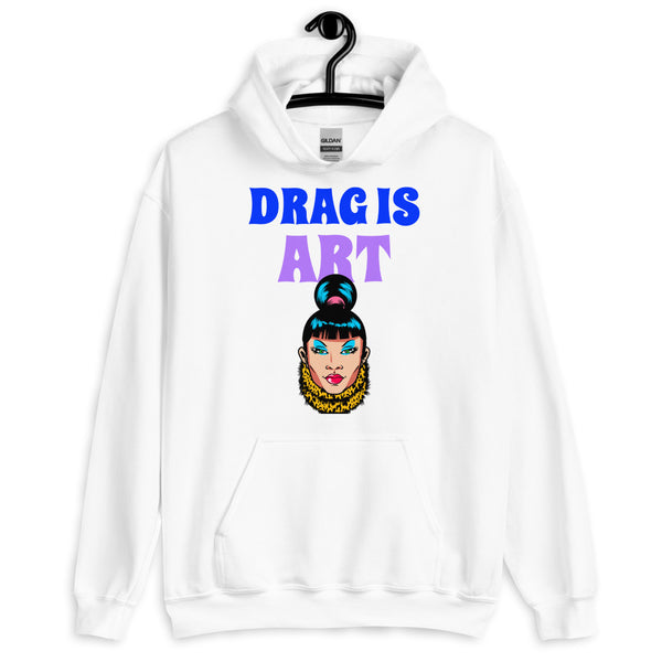 Front view of a white hoodie reading “DRAG IS ART” above a colorful drag-style face graphic