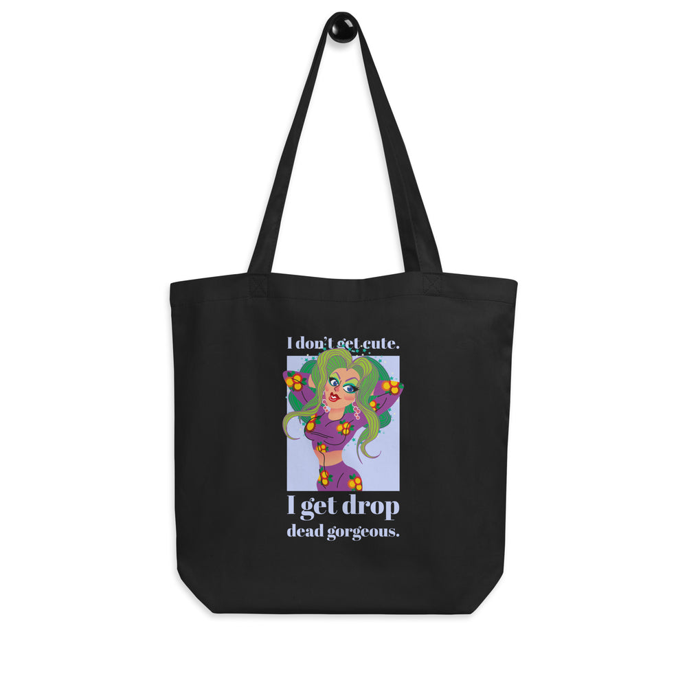 Front view of a black tote bag reading “I don’t get cute. I get drop dead gorgeous.”