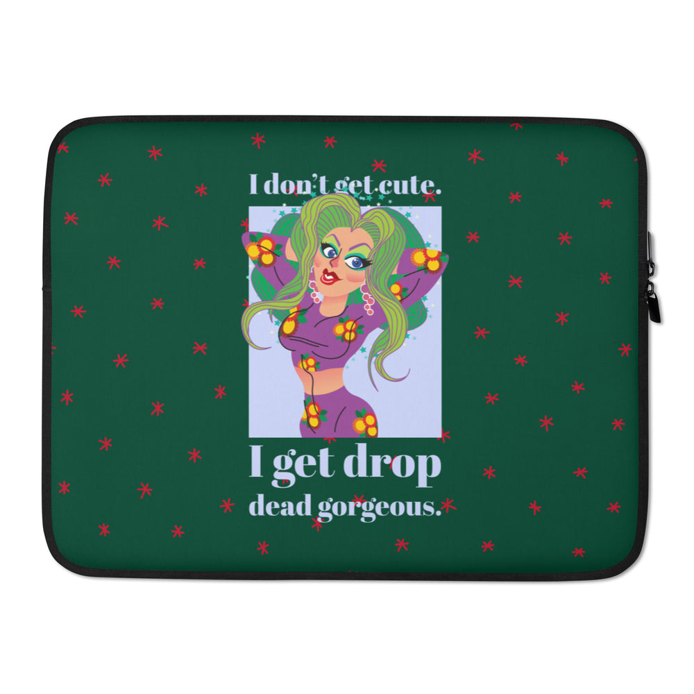 Front view of a dark green laptop sleeve with a drag queen illustration and “I don’t get cute. I get drop dead gorgeous.”