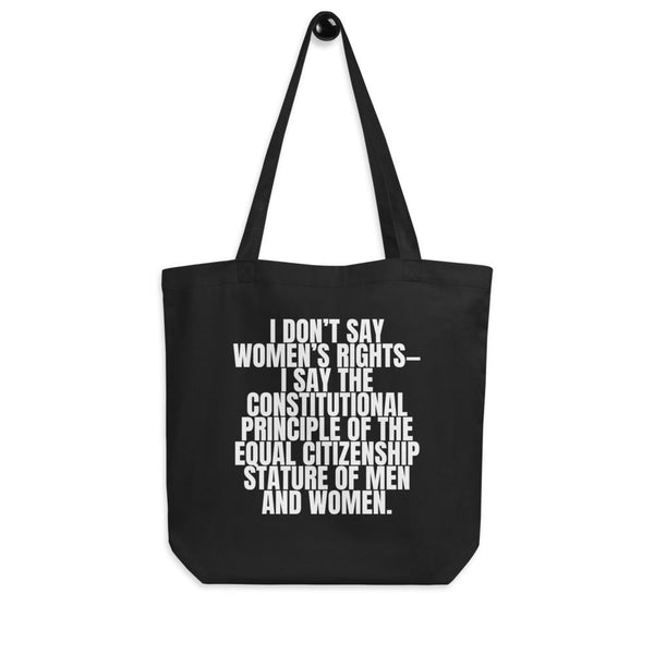 Black eco tote bag with white text reading “I DON’T SAY WOMEN’S RIGHTS—” and an equality statement