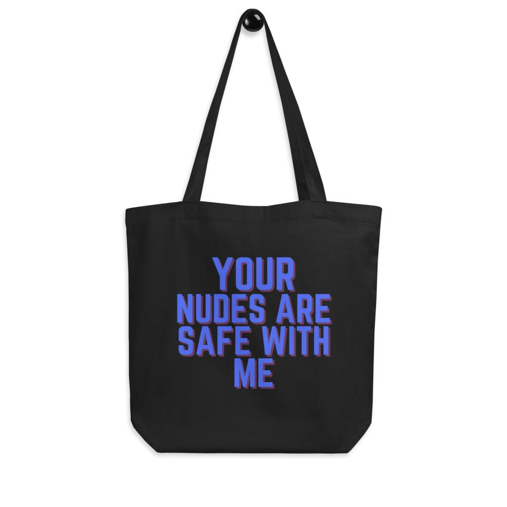 Black tote bag printed with “YOUR NUDES ARE SAFE WITH ME” in blue and red lettering