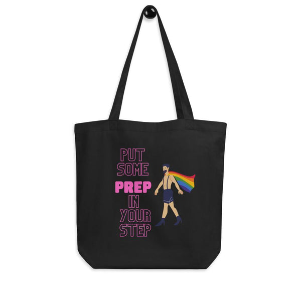 Black tote bag with “PUT SOME PREP IN YOUR STEP” text and a rainbow-caped figure