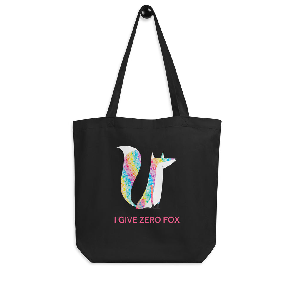 Front view of a black tote bag with a colorful fox graphic and “I GIVE ZERO FOX” in pink