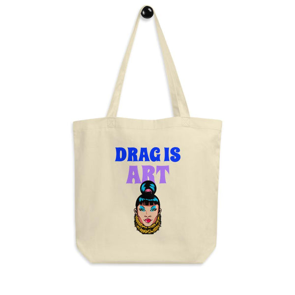 Cream eco tote bag reading “DRAG IS ART” with a colorful drag performer illustration