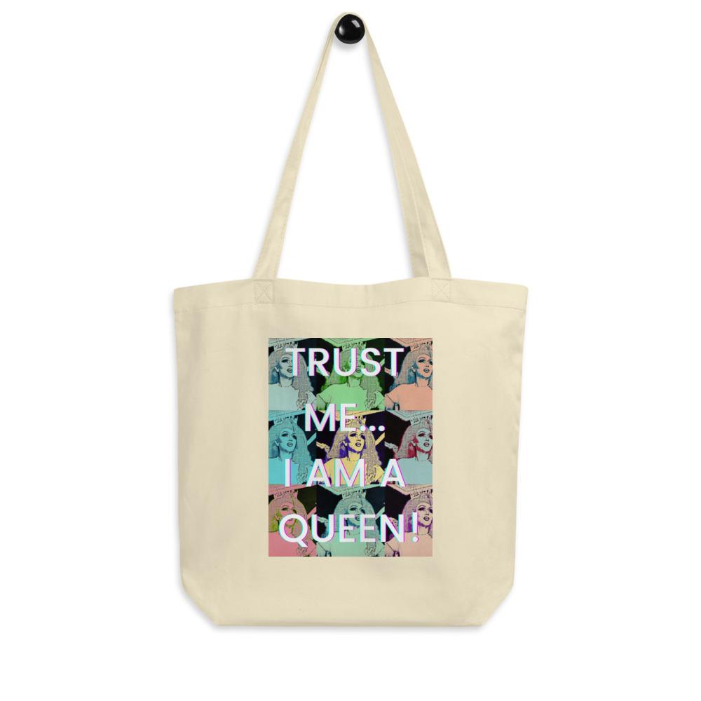 Cream eco tote bag with colorful pop-art faces and the slogan “TRUST ME... I AM A QUEEN!”