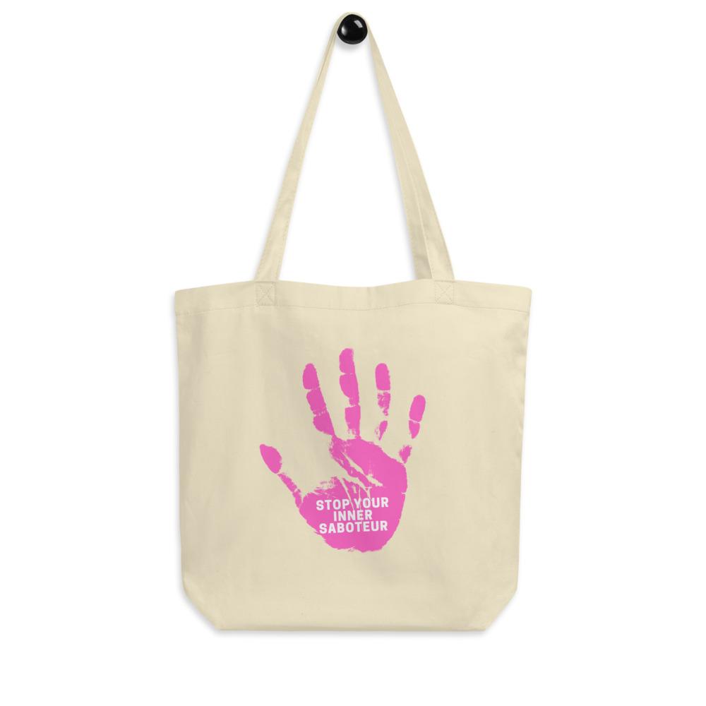 Cream canvas tote bag with a pink handprint and “STOP YOUR INNER SABOTEUR” text