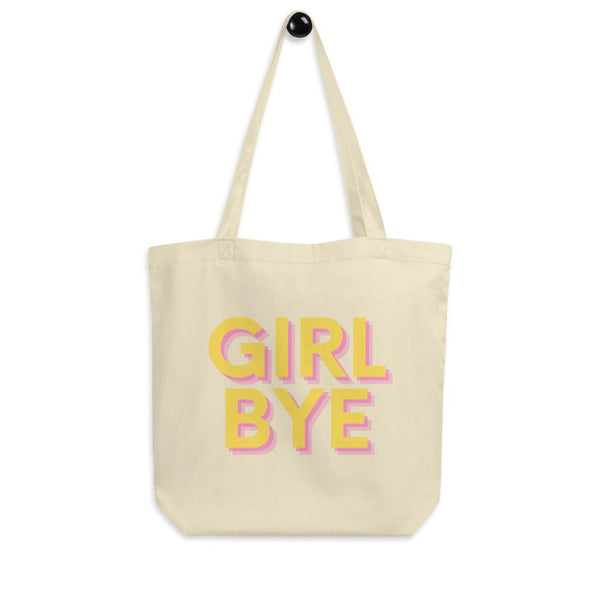 Cream tote bag with pink and yellow shadowed “GIRL BYE” lettering