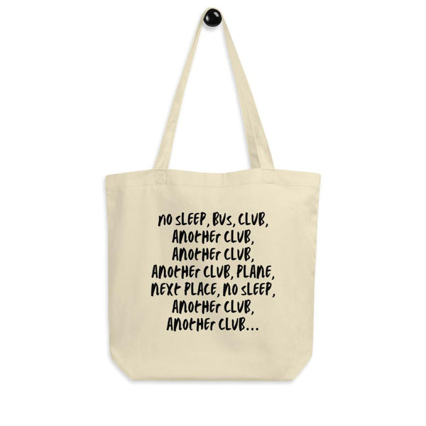 Cream eco tote bag with black text reading “No Sleep, Bus, Club, Another Club…”